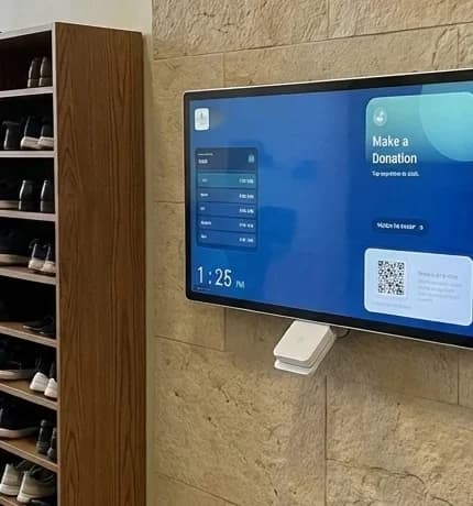 Givebear wall-mount donation kiosk in a masjid hallway