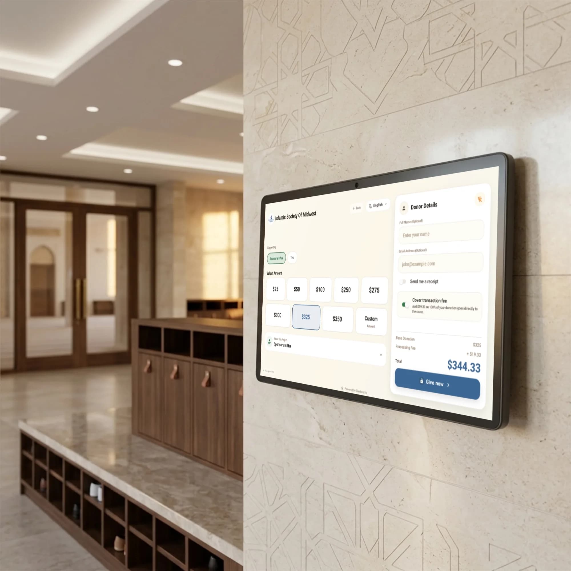 Wall-mounted Givebear donation kiosk inside a mosque lobby for zakat and sadaqah giving
