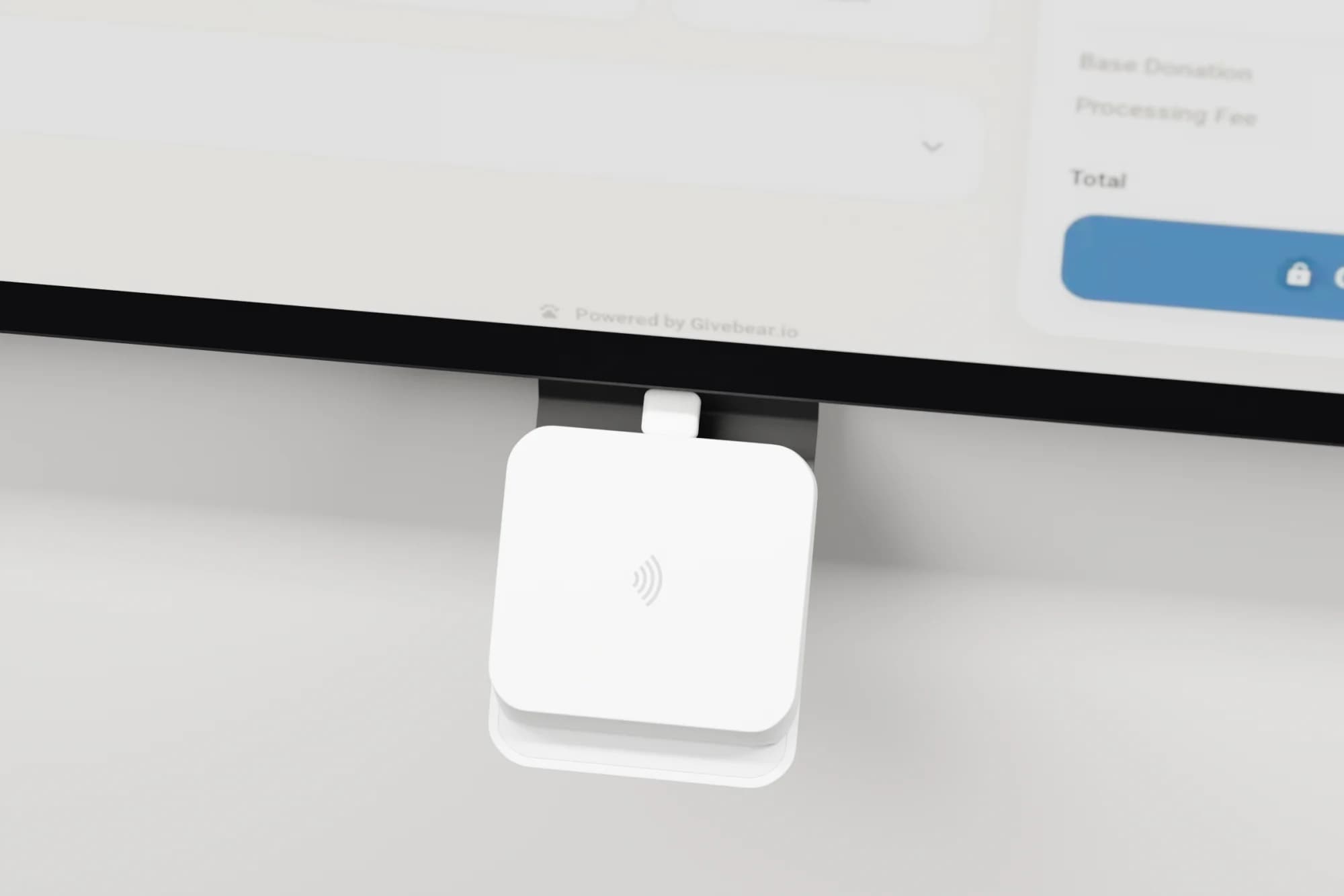 The contactless card reader mounted under a Givebear kiosk screen